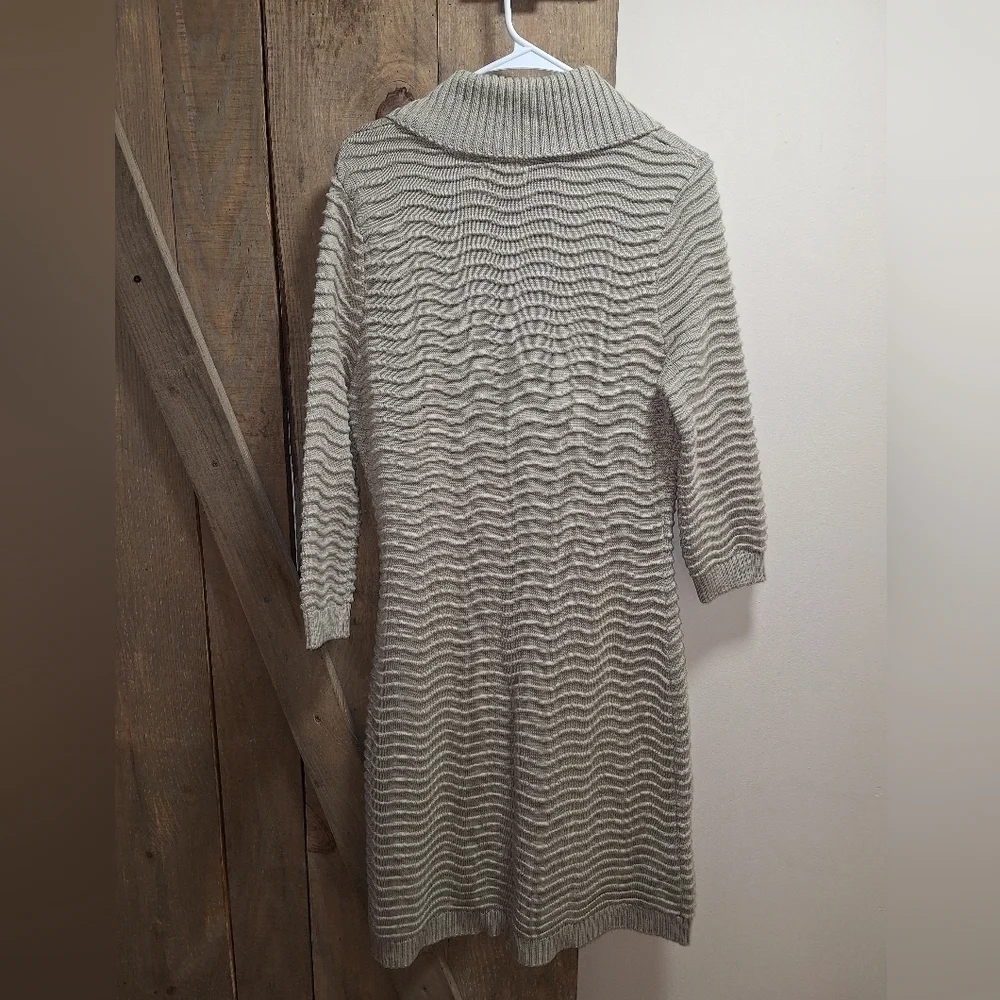 A Calvin Klein faux wrap ribbed knitted sweater dress in a ladies size medium.